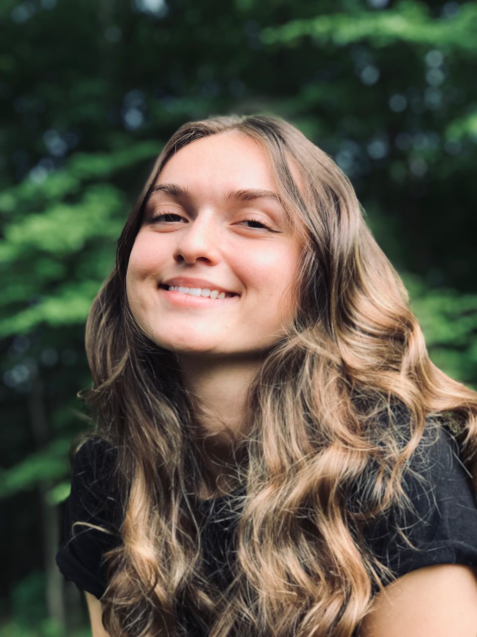 Women smiling with a black shirt one